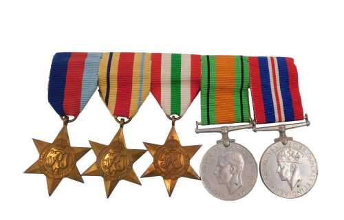 A group of World War II medals, comprising the 1939-45 Star, the Africa Star, the Italy Star,...