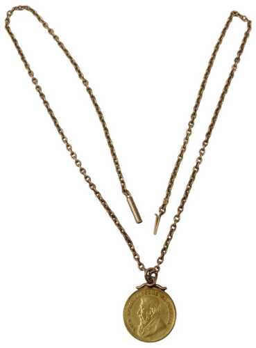 A South African Half Pond gold coin pendant and chain, dated 1896, with a rose gold mount, on a...