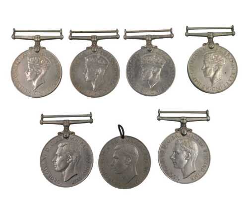 A collection of WWII medals, consisting of two Defence medals and one Defence medal disc,...