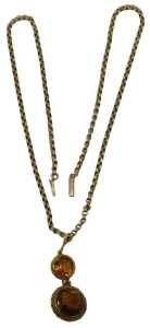 A late 19th/early 20thC citrine pendant and chain, the two layered pendant set with two citrines,...