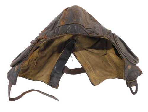 A WWII RAF B Type leather flying helmet, with zip up earphone pockets, Air Ministry marked, made...