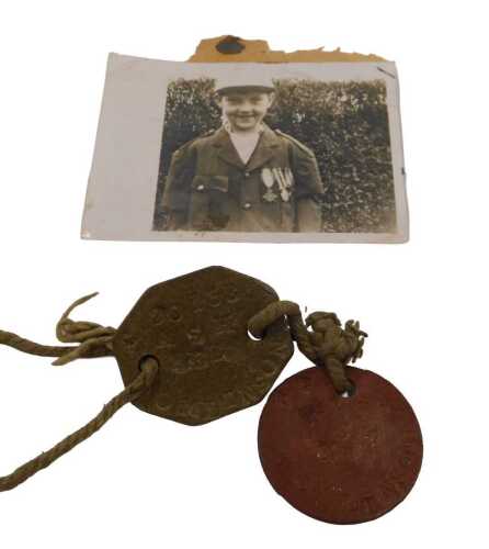 World War I identity tags, a pair of fibre tags and original string, belonging to John Tomlinson,...