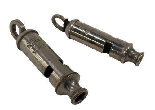 An Acme City whistle, together with a City police or fire whistle.