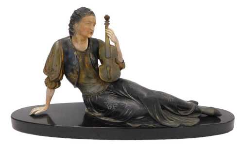 A spelter figure of a seated musician, in flowing robes, on oval base, 33cm high.