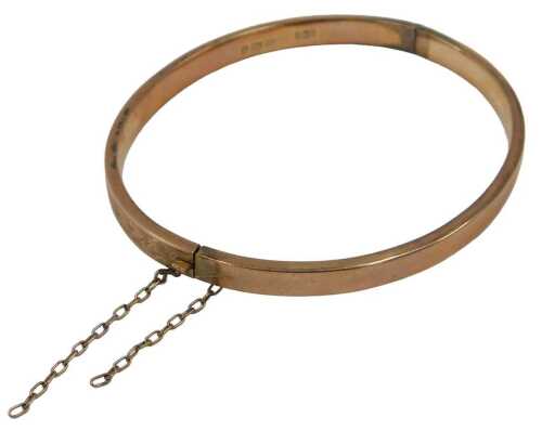 A 9ct rose gold half hinged bangle, with part floral design, 6cm diameter, 5.1g, boxed.