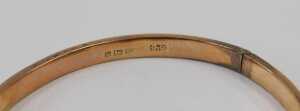 A 9ct rose gold half hinged bangle, with part floral design, 6cm diameter, 5.1g, boxed. - 2