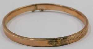 A 9ct rose gold half hinged bangle, with part floral design, 6cm diameter, 5.1g, boxed. - 3