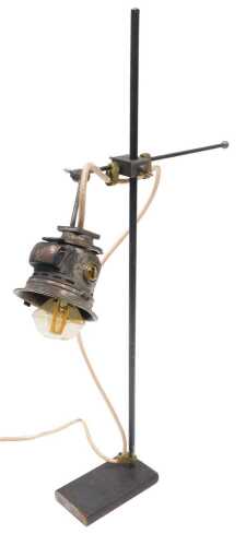 A retro table lamp, formed with an acetylene top, marked British Miller Made, on hand made...
