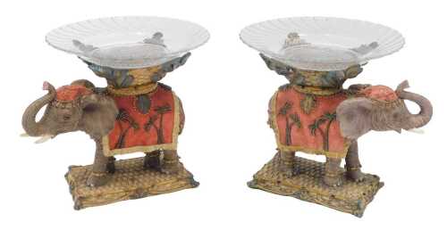 A pair of 20thC serving pieces, formed with moulded glass dishes with floral centres, on...