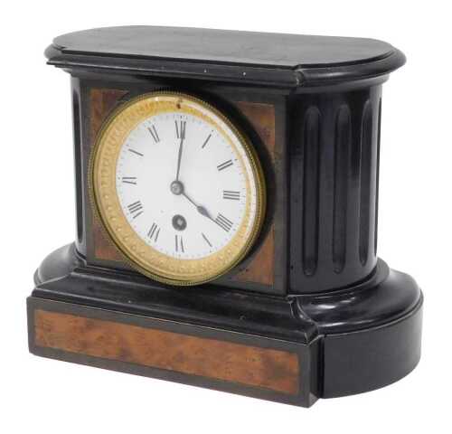 An early 20thC ebonised mantel clock, with 9cm diameter Roman numeric enamel dial, in a shaped...