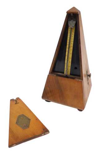 An early 20thC mahogany cased Maelzel metronome, of tapering form with front opening revealing...