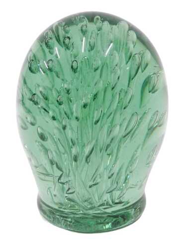 A 19thC Stourbridge style green glass dump, with flower head decoration, rough pontil, 16cm high.