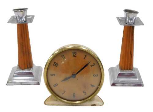A pair of mid-20thC Art Deco phenolic Bakelite and chrome plated candlesticks, and a metal...