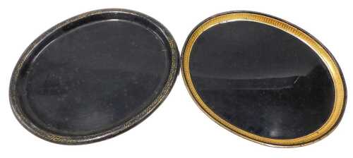 A 19thC Toleware tray, of oval form with gilt highlight border, and another with a geometric...