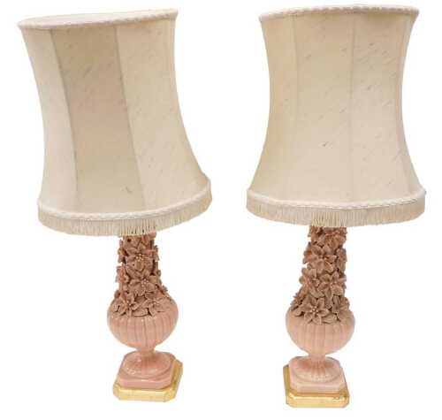 A pair of late 20thC pottery table lamps, heavily decorated with flower heads in peach, on...