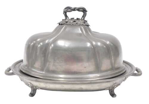 A 19thC pewter meat dish and cover, with entwined handle, removable lid revealing an oval stand...