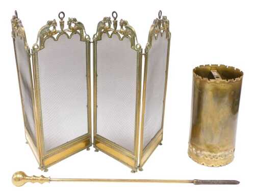 A 20thC brass shade, of cylindrical form, partially pierced, a four fold brass framed spark...