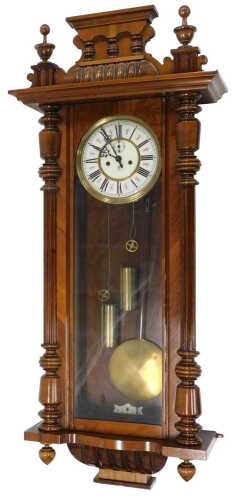 A late 19thC walnut cased Vienna wall clock, the 20cm diameter Roman numeric dial with fancy...
