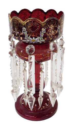 A 19thC ruby glass lustre, with castellated top, painted and raised with flowers, with gilt...