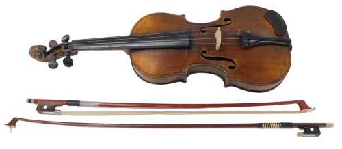 An early 20thC pine two piece violin, with scroll end and ebonised knops, 57cm long, the main...