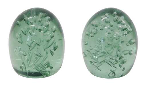 A pair of late 19thC Stourbridge style green glass dumps, each with bubble decoration in green,...