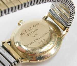A Garrard 9ct gold cased gent's wristwatch, with a silvered baton dial with date aperture,... - 2