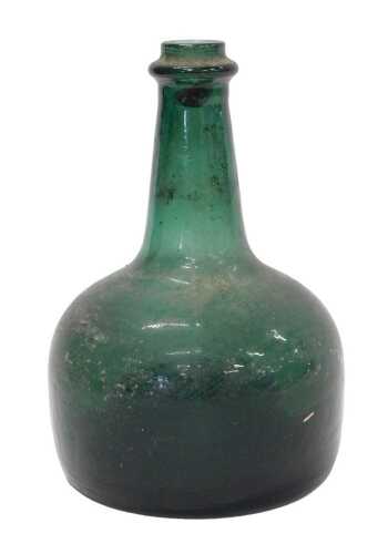 A green glass onion shaped bottle, with cylindrical stem, shouldered body and inverted base,...