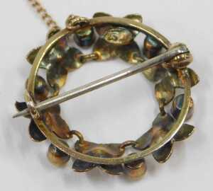 A 20thC circular brooch, formed as a flower ring, set with seed pearls and turquoise, on single... - 2