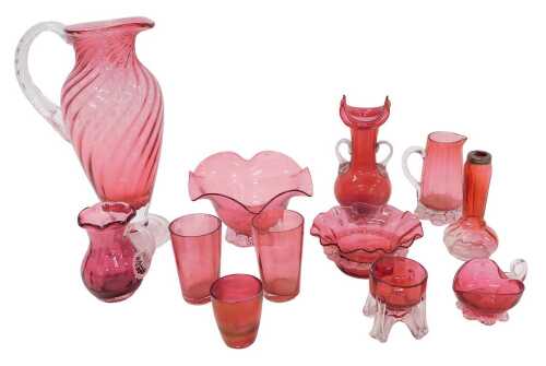 Various cranberry and ruby glassware, early 20thC and others, a jug of flared form with clear...