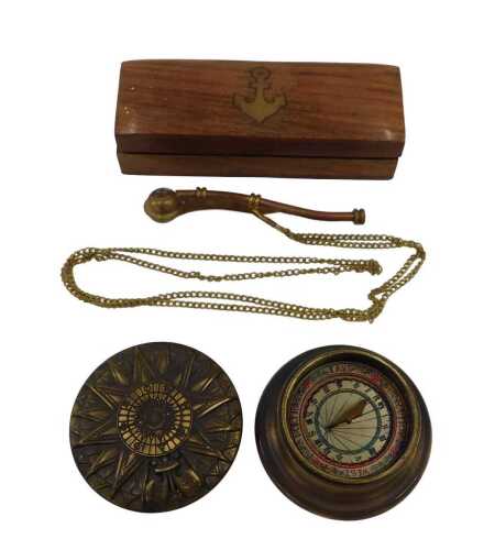 A Brujula Solar brass cased sun dial compass, in the 19thC style, 9cm diameter, and a copper and...