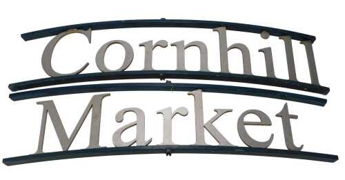Lincoln Interest. Two metal signs, one reading Cornhill the other Market, each curved in green...