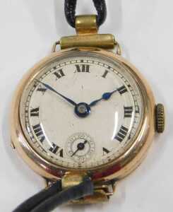 A 9ct gold cased wristwatch head, with a silvered Roman numeric dial, seconds dial and blue... - 2