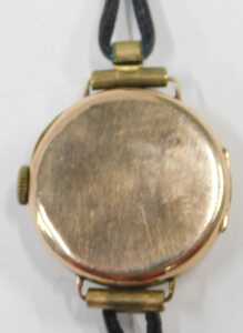 A 9ct gold cased wristwatch head, with a silvered Roman numeric dial, seconds dial and blue... - 3