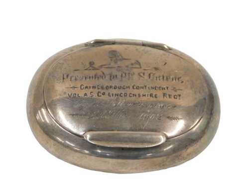An Edward VII silver snuff box, of oval form, with thumb mould lid, marked presented to PTE S...
