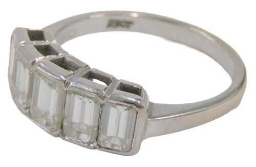 A diamond five stone dress ring, set with five rectangular cut diamonds of graduated size,...