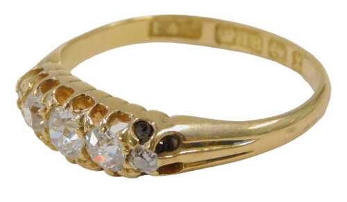 An Edwardian 18ct gold diamond set gypsy ring, set with five old cut diamonds, ranging in size...