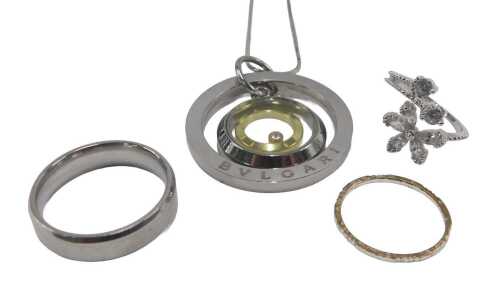 A Bulgari pendant, and various white metal rings, some marked. (a quantity)