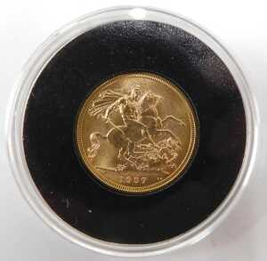 An Elizabeth II full gold sovereign, 1957, in proof style casing with Royal Mint The Sovereign... - 2