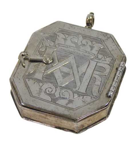 A reliquary, the front and back hinging to reveal oils on tin of Our Lady of the Most Holy...