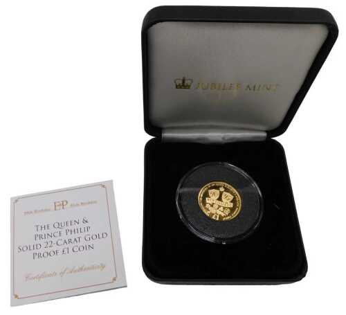 An Elizabeth II The Queen and Prince Philip 22ct gold proof one pound coin, for their 90th and...