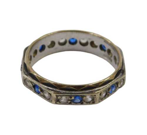 A 9ct gold eternity ring, of bicolour design with yellow and white gold, set with blue and white...