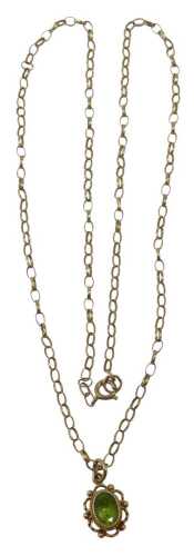 A 9ct gold pendant and chain, the floral pendant set with oval cut peridot, 1cm high, on a fine...