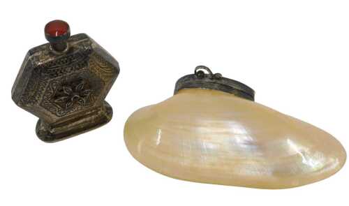 An early 20thC perfume bottle, of hexagonal form, profusely decorated and raised with flower,...
