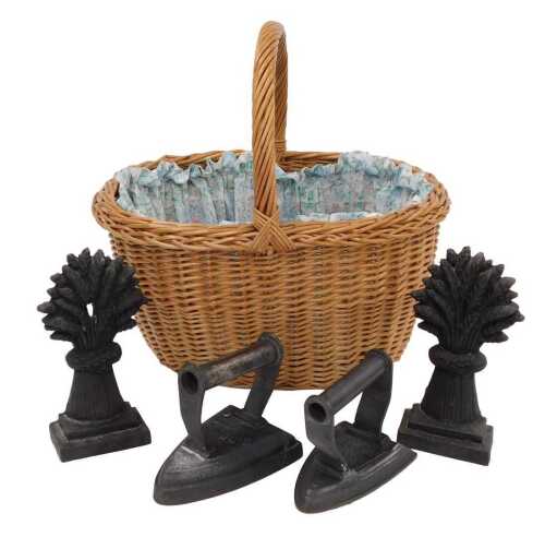 Various cast iron items, a flat iron, 10cm high, another similar, and two wheat shaped doorstops,...