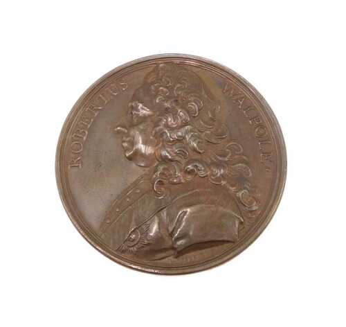 A bronze medallion after Antoine Dassier, a bronze medallion of Robert Walpole, inscribed to the...
