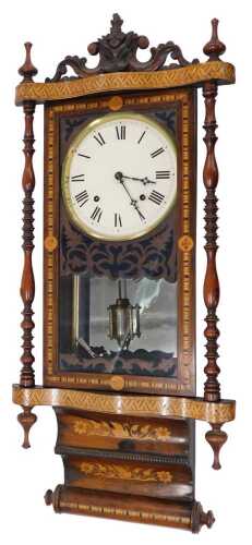 A 19thC American wall clock, the 21cm diameter Roman numeric dial, in a heavily carved inlaid...