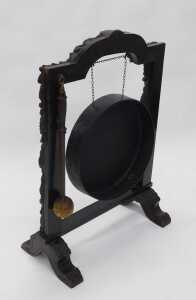 A 19thC oak framed dinner gong, heavily carved with lion's masks surrounded by berries, leaves... - 2