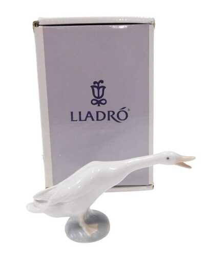 A Lladro figure goose, 9cm high, boxed.