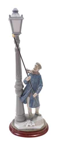 A Lladro figure group The Lamplighter, 45cm high.