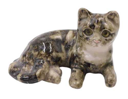 A Winstanley pottery figure of a seated cat, 15cm long.